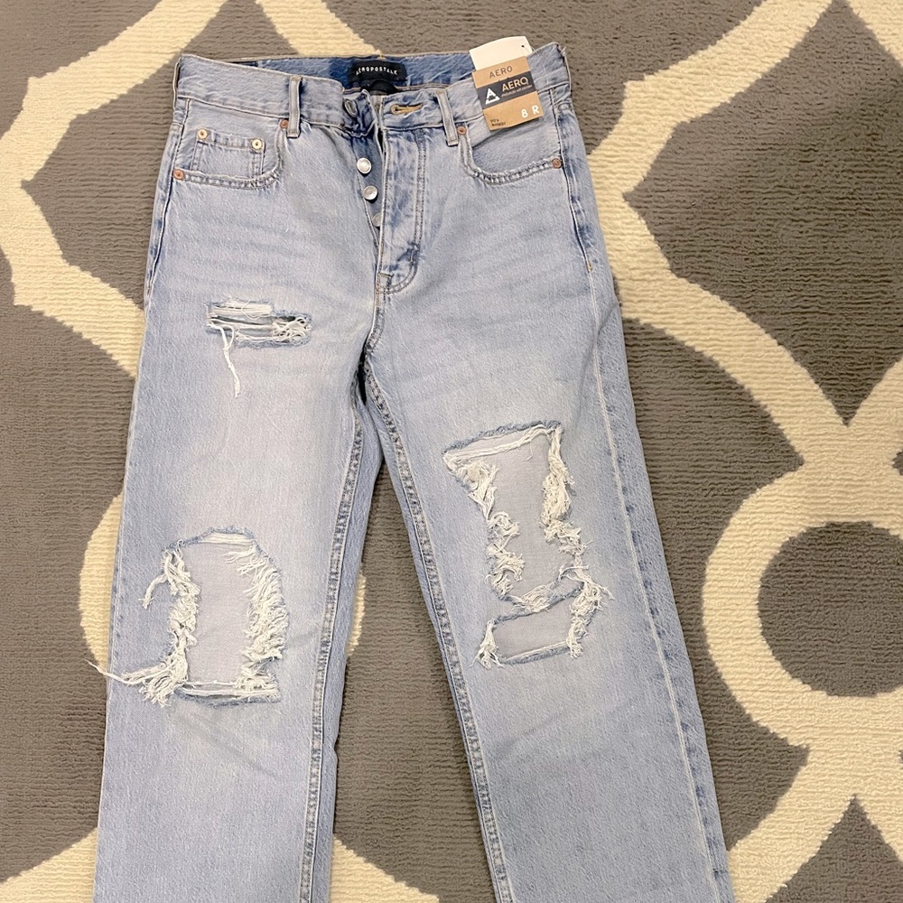 Aero distressed faded jeans. Never worn. 90’s baggy style. Size 8 regular